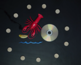 Abstract elements surrounding a lobster, a CD, and other signifiers of potential commons.
