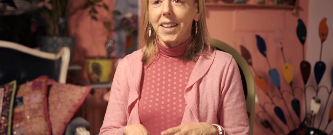 A picture of Medea Benjamin, wearing pink.